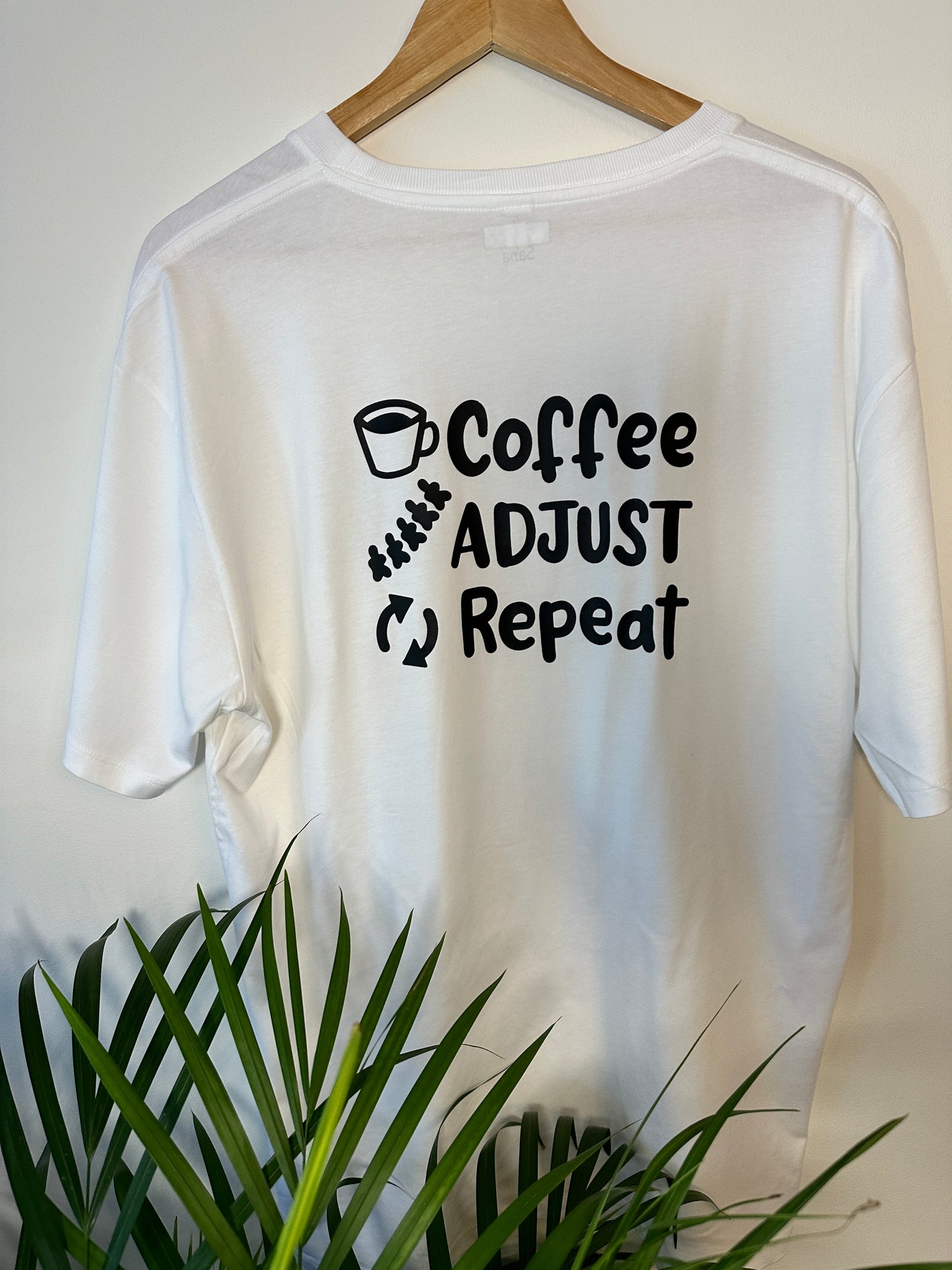 'Coffee Adjust Repeat' Unisex T-shirt (White)